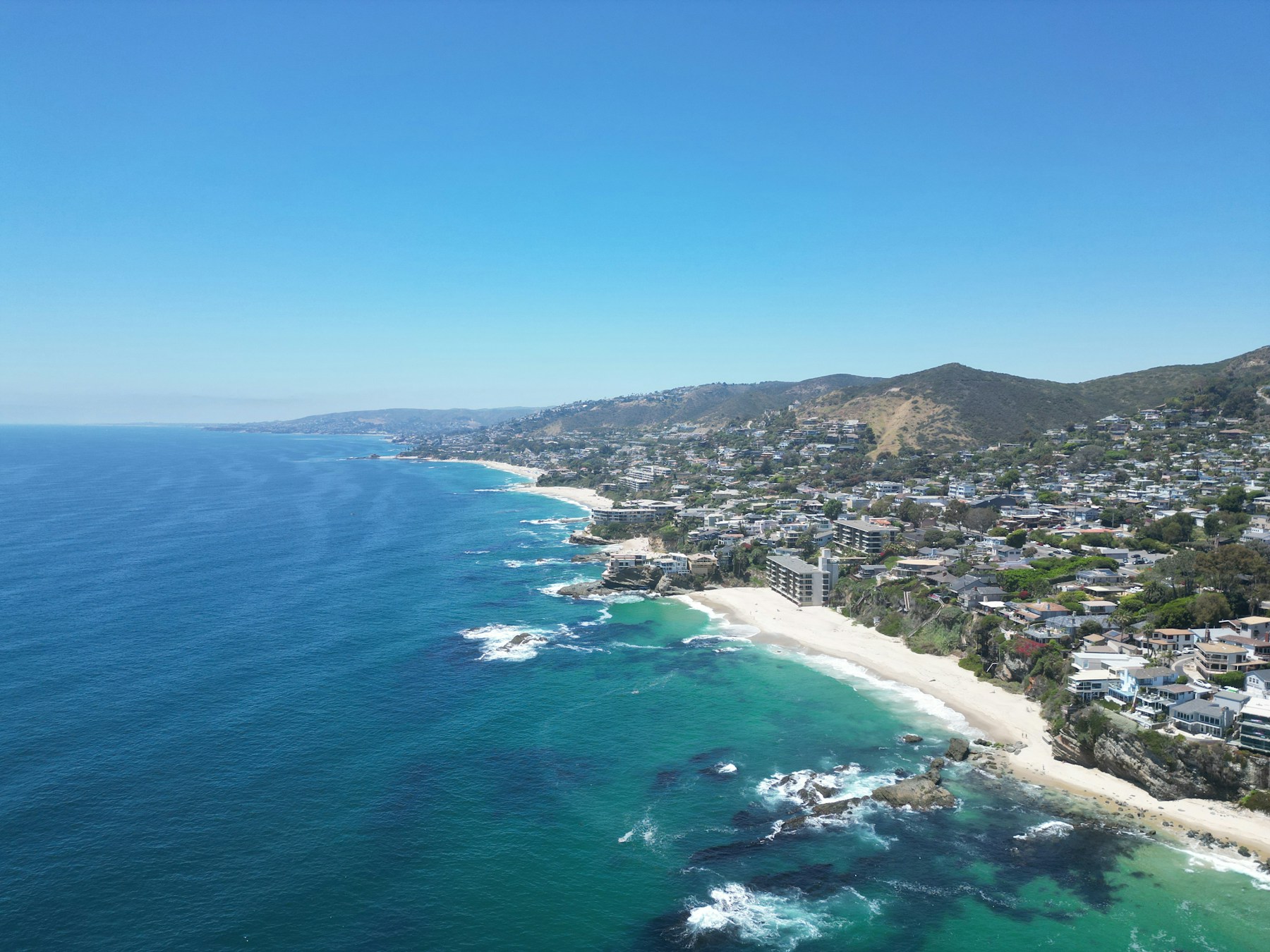 Aerial view of the Orange County coastline and beachfront neighborhoods