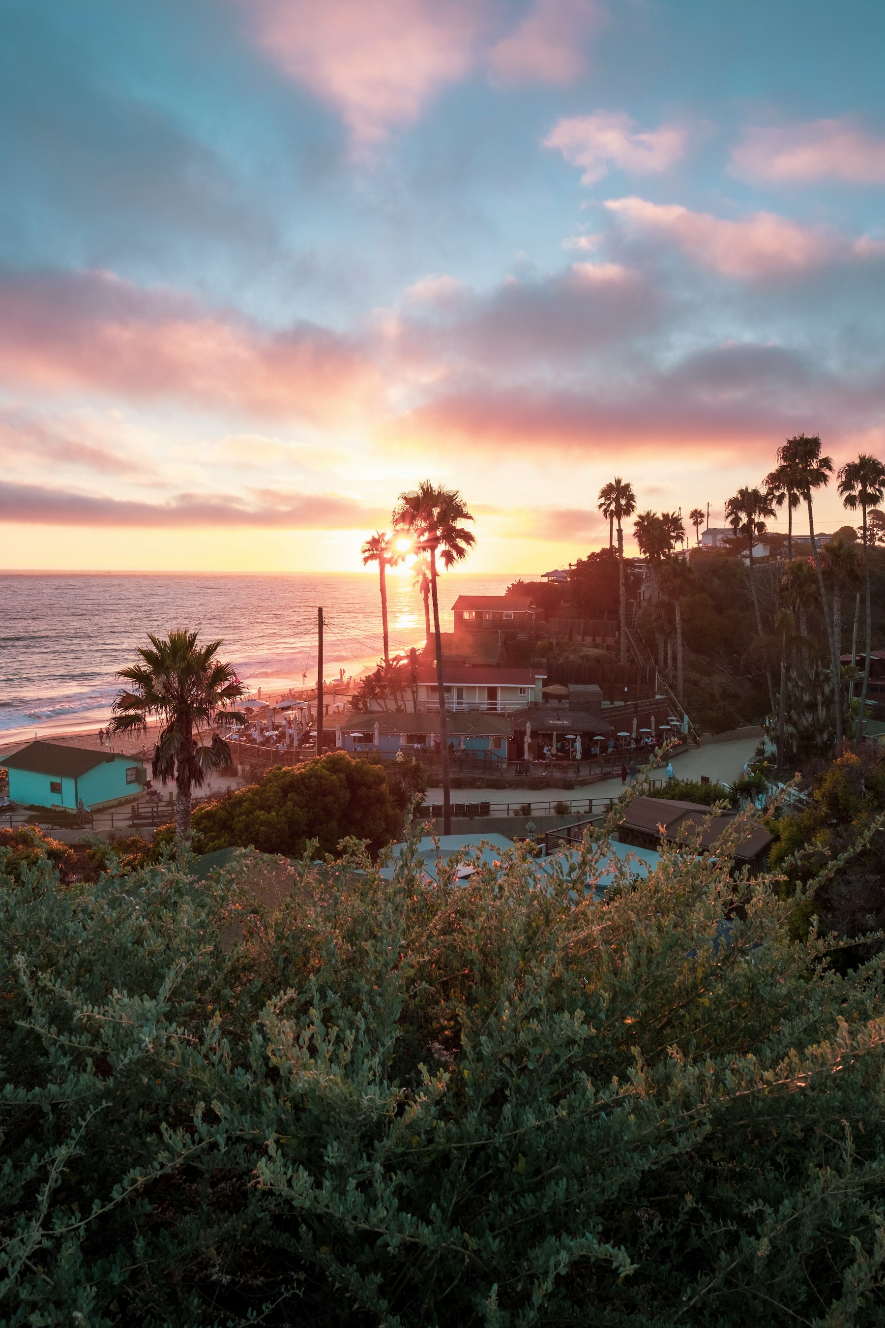 Coastal Orange County homes above the Pacific at sunset